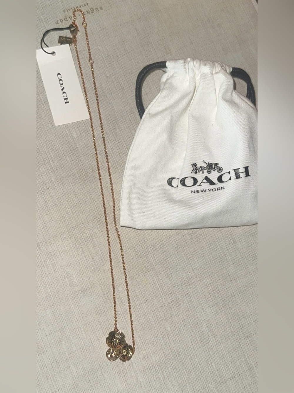 Coach Gold-Tone Floral Pendant Necklace with Drawstring Pouch